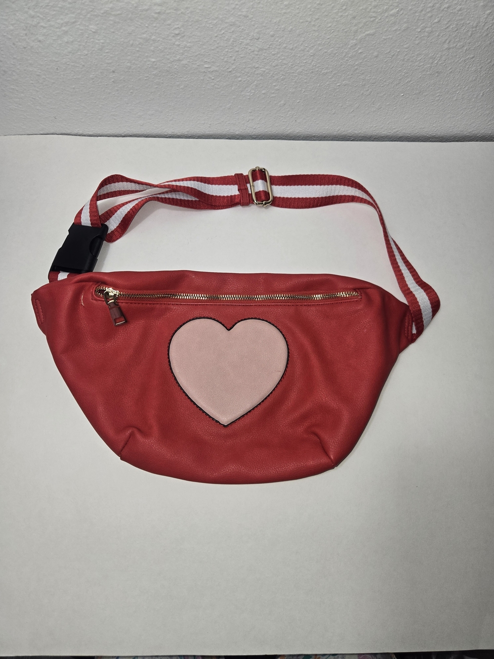 Red fau leather, fanny pack with central pink heart patch with adjustable straps